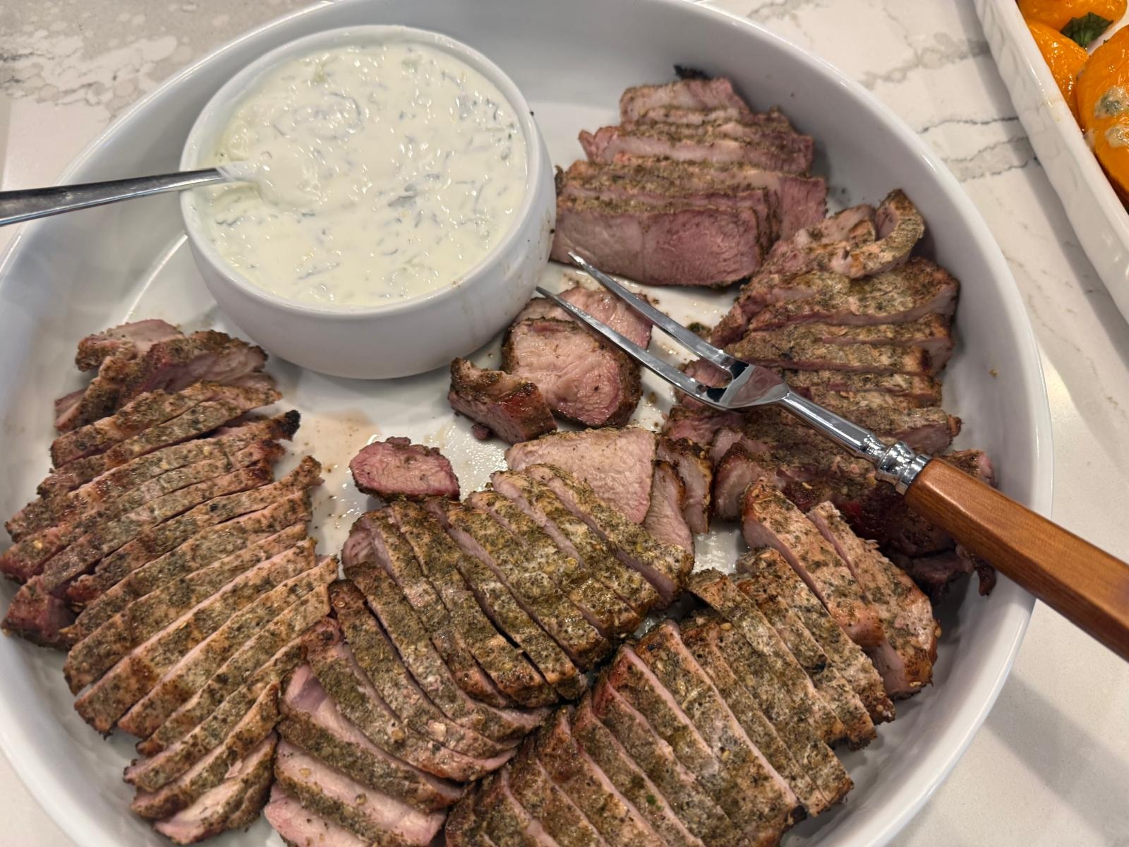 Herb crusted sliced meat with tzatziki — private chef Tampa FL